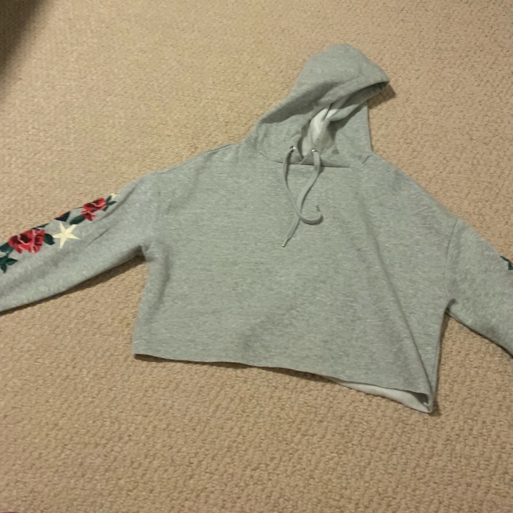 grey copped hoodie floral design on sleeve